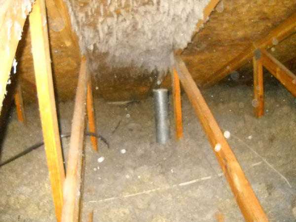 Dryer vent depositing lint into the attic of a home
