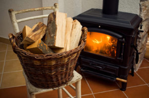 wood stove and basket of wood