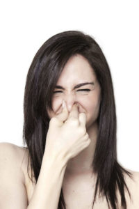 woman smell foul odors