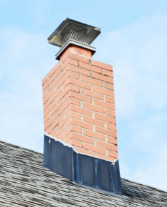 red brick chimney with cap