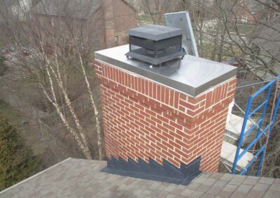 red brick chimney with new chase cover